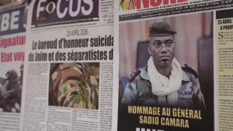 Reuters Newspapers at a stand in Bamako with a headline mourning the killed defence minister.